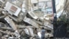 LEBANON - A man looks at the destruction at the site of an overnight Israeli airstrike on the Ruwais neighborhood in Beirut's southern suburbs on October 1, 2024. 