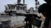 This screen grab made on July 26 from undated handout video footage released by the US Central Command on July 25 shows what CENTCOM says are operations enforcing its naval blockade against Iran.