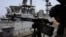 This screen grab made on July 26 from undated handout video footage released by the US Central Command on July 25 shows what CENTCOM says are operations enforcing its naval blockade against Iran.