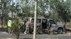 Afghan security officials inspect a vehicle used by the militants during attack on the Interior Ministry building in Kabul on May 30.