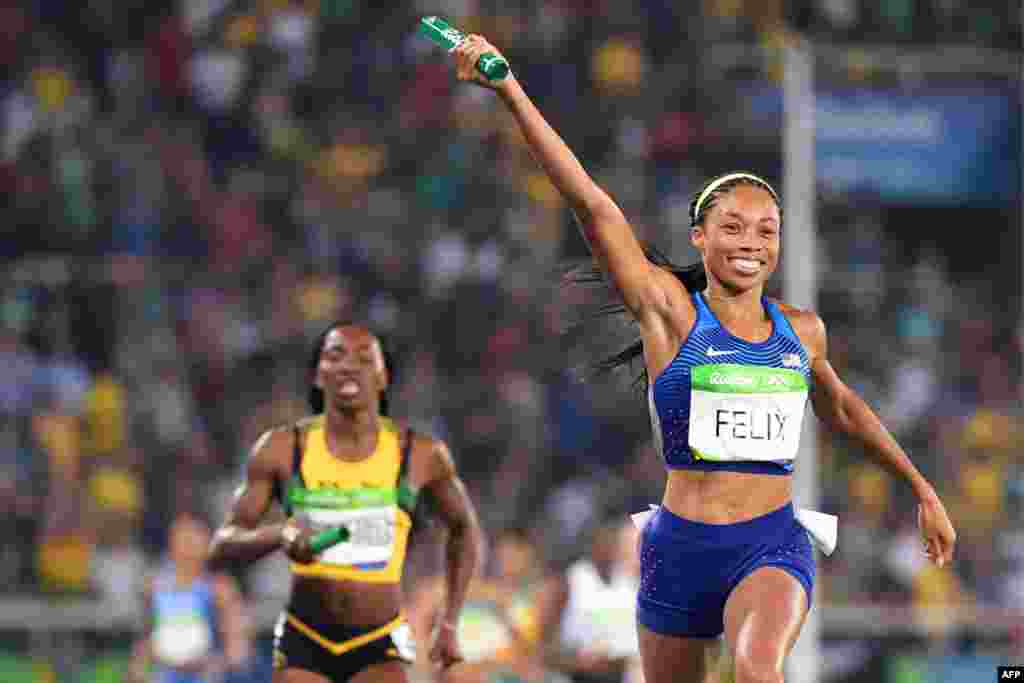 &nbsp;Allyson Felix of the United States celebrates as she crosses the finish line after helping her team win a record sixth gold medal in the women&#39;s 4x400 meters.