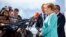 German Chancellor Angela Merkel speaks to the media as she arrives for an informal EU summit in Bratislava on September 16. 