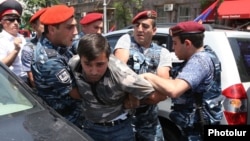 Armenia - Police detain a protester during a demonstration against traffic fines in Yerevan, 19Jun2014.