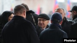 Armenia -- Vazgen Manukian (C) and other leaders of the opposition Homeland Salvation Movement talk during a rally at Liberty Square, Yerevan, February 20, 2021.