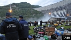 Rescue workers search for survivors among the rubble of the Sayano-Shushenskaya hydroelectric power plant.