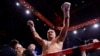 Oleksandr Usyk celebrates winning his fight against Daniel Dubois in London on July 19. 