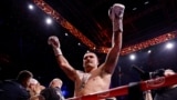 Oleksandr Usyk celebrates winning his fight against Daniel Dubois in London on July 19. 