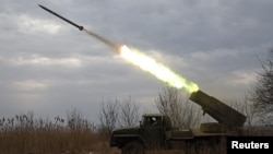 A multiple-launch rocket system based on the BM-21 "Grad" fires a rocket near the front line in the Donetsk region on February 27.