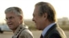 U.S. Defense Secretary Rumsfeld (right) on a trip to Iraq in April