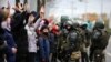 Police block protesters during a march of opposition supporters from central Minsk to a site of Stalin-era executions just outside the capital on November 1.