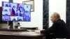 Putyin elnök a Crocus City Hallban elkövetett támadásokra adott válaszintézkedésekről szóló videókonferencián Moszkva melletti rezidenciáján 2024. március 25-én