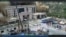 Un val de noroi și apă distruge clădirile dintr-o vale de la granița dintre Nepal și China, în Gyirong (stop cadru din video de supraveghere)