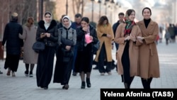 Women walk through a street in the Chechen capital, Grozny. In the past month, the republic's authorities have issued several new restrictions on women's clothing. 