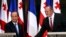 Georgia's President Giorgi Margvelashvili (right) greets his French counterpart Francois Hollande in Tbilisi, May 13, 2014.