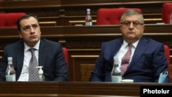 Davit Khachaturian (left) and Gagik Jahangirian attend a session of the Armenian parliament on January 22.