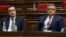 Davit Khachaturian (left) and Gagik Jahangirian attend a session of the Armenian parliament on January 22.