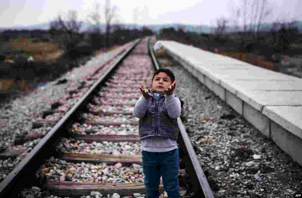 A boy from Iraq plays on rail tracks close to a refugee camp in Gevgelija, Macedonia. (AFP/Robert Atanasovski)