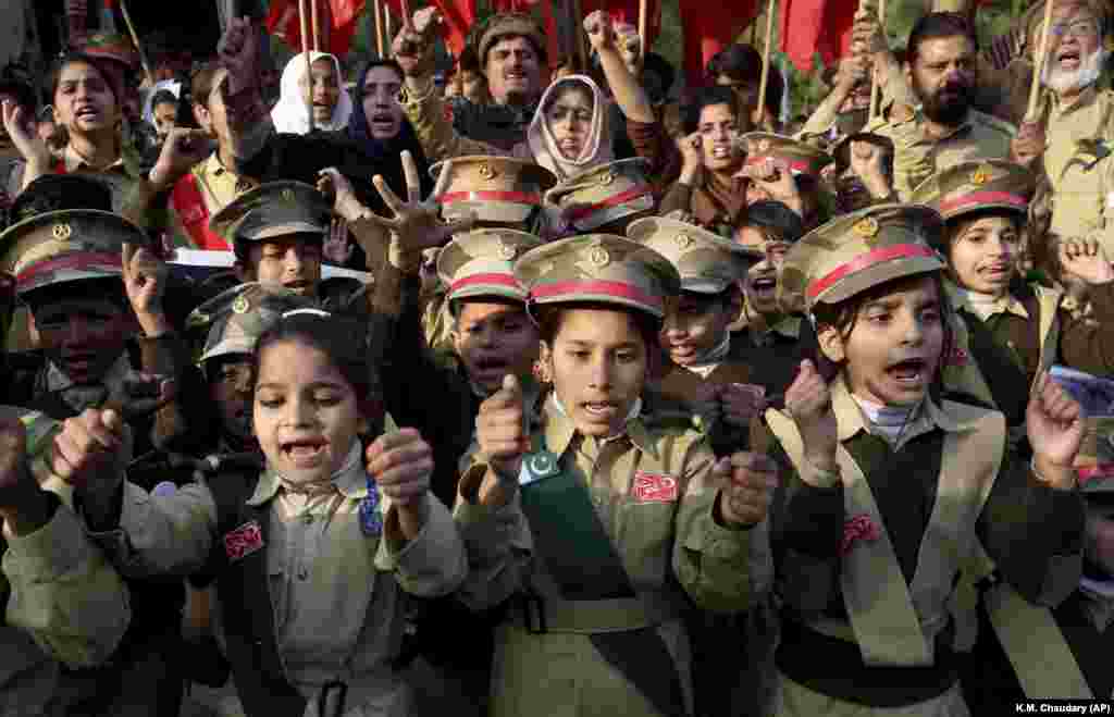 Children wearing army uniforms protest against the recent U.S. attack in Iraq that killed Iranian military commander Qasem Soleimani, near the U.S. consulate in Lahore, Pakistan. (AP/K.M. Chaudary)