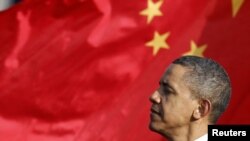 U.S. -- President Barack Obama listens as Chinese President speaks during an official South Lawn arrival ceremony for Hu at the White House in Washington, DC, 19Jan2011