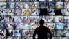 A man looks at a screen showing polling stations at the headquarters of Russia's Central Election Commission in Moscow on September 19.