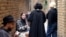 Young Iranians gather at the outdoor smoking area of a cafe in Tehran in February 2025.