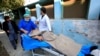 Hospital workers carry Tetsu Nakamura to a hospital after an attack in Jalalabad on December 4.