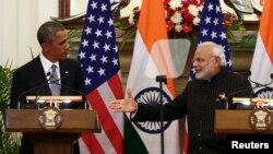 Indian Prime Minister Narendra Modi, right, reaches out to shake hands with U.S. President Barack Obama after giving their opening statements at Hyderabad House in New Delhi, January 2015.