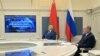 Russian President Vladimir Putin (right) and Belarusian strongman Alyaksandr Lukashenka observe ballistic missile exercises from the Kremlin situation room in Moscow on February 19. 