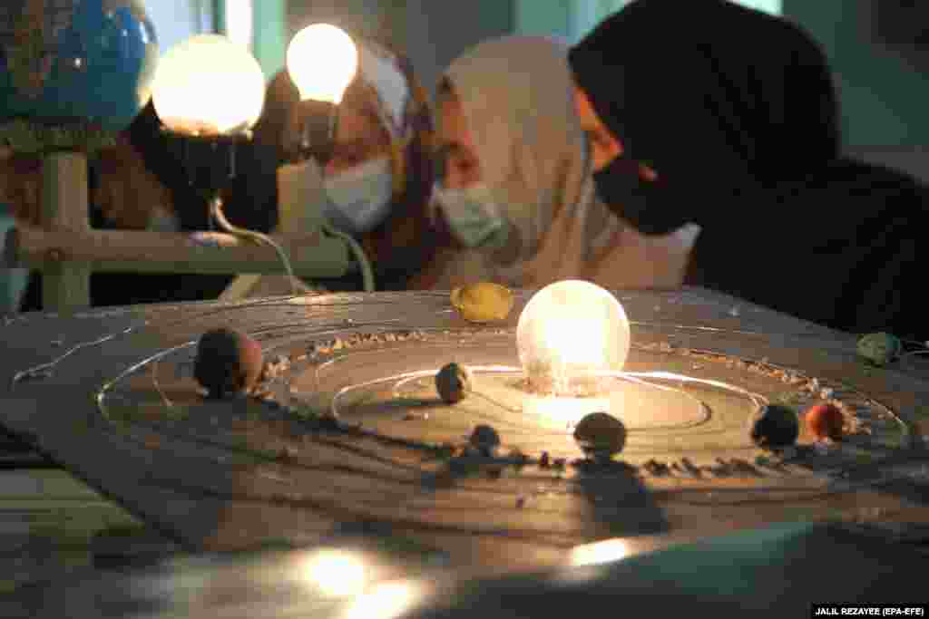 Afghan girls attend a school to learn astronomy in Herat.