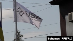 A Uni Stone Plant (USP) flag flies at the former office of Unigran in Ukraine's Zhytomyr region.