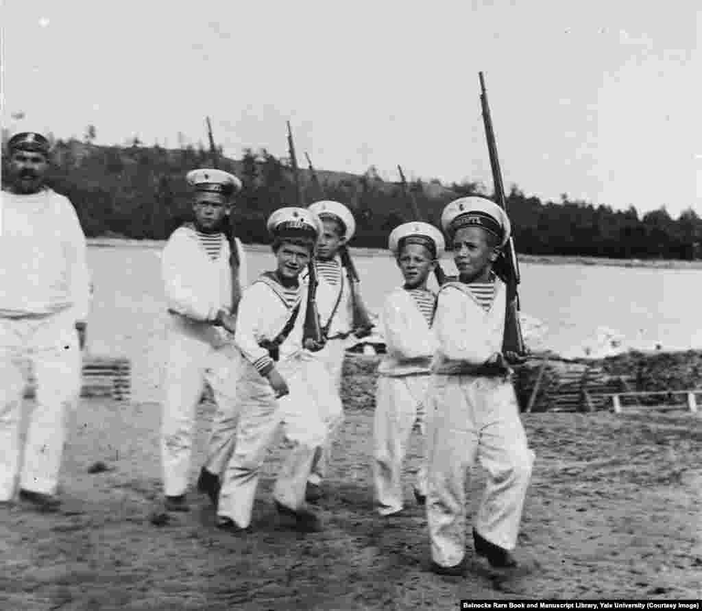 Tsarevich Aleksei, third from left, playing soldiers. Andrey Derevenko (far left) was one of two minders tasked with looking after the vulnerable heir apparent. Derevenko joined the Bolsheviks soon after the revolution and taunted the tsarevich before disappearing into obscurity.