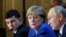 Ukraine's President Volodymyr Zelenskiy, German Chancellor Angela Merkel, and Russia's President Vladimir Putin attend a joint news conference after a summit in Paris on December 10.