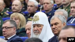 Patriarhul Kirill particpând la o ședință cu șefii complexului militar al Rusiei, la 10 decembrie 2023. (Foto: Sputnik) 