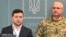 Ukrainian President Volodymyr Zelensky speaks, flanked by Ruslan Khomchak, military commander of the Armed Forces of Ukraine, at a briefing following an outbreak of violence with Russia-backed separatists, in Kyiv on February 18.