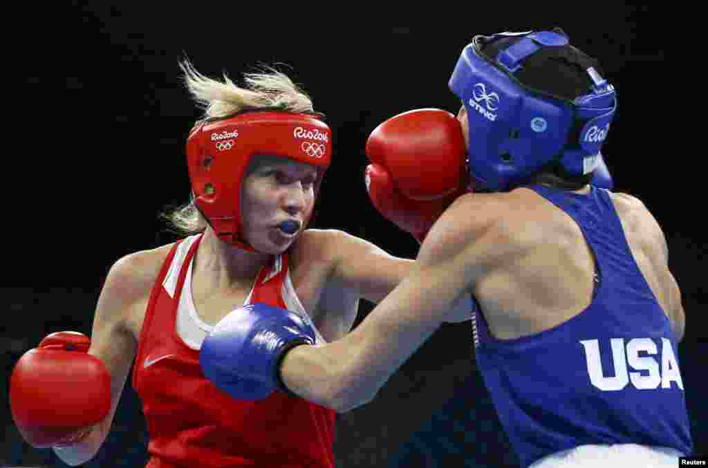 Anastasia Belyakova of Russia fights Mikaela Mayer of the United States in the women&#39;s 60-kilogram boxing quarterfinals.