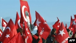 Supporters of the nationalist group Ergenekon rally as the trial opens