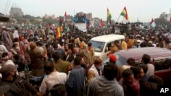 Supporters of the Pakistan Democratic Movement, an alliance of opposition parties, attend an anti-government rally in Multan, Pakistan on November 30.