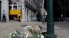 Flowers in tribute to the victims are pictured on the site of the Gloria funicular railway the day after the accident that left 15 dead in Lisbon, on September 4, 2025.