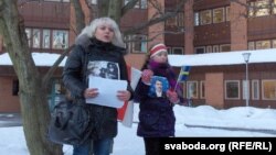 Volha Klaskouskaya (left)protests outside the Belarusian Embassy in Stockholm in January 2011.