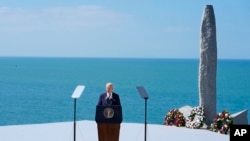 U.S. President Joe Biden delivers a speech on the legacy of Pointe du Hoc, and democracy around the world, on June 7 as he stands next to the Pointe du Hoc monument in Normandy, France.