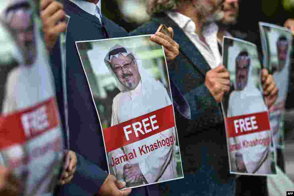 Protesters hold pictures of missing journalist Jamal Khashoggi during a demonstration in front of the Saudi Arabian Consulate in Istanbul on October 5. (AFP/Ozan Kose)