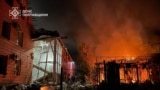 Buildings are damaged and in flames after an attack on Kremenchuk, Ukraine, on June 6