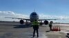 Armenia - Marshallers guide a plane that landed at Zvartnots international airport, Yerevan, January 15, 2021.