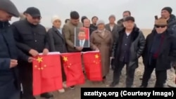 A screenshot of a video of an anti-China demonstration against Chinese policies in Xinjiang on November 13, 2025. The organizers are facing charges for "inciting interethnic hatred." 