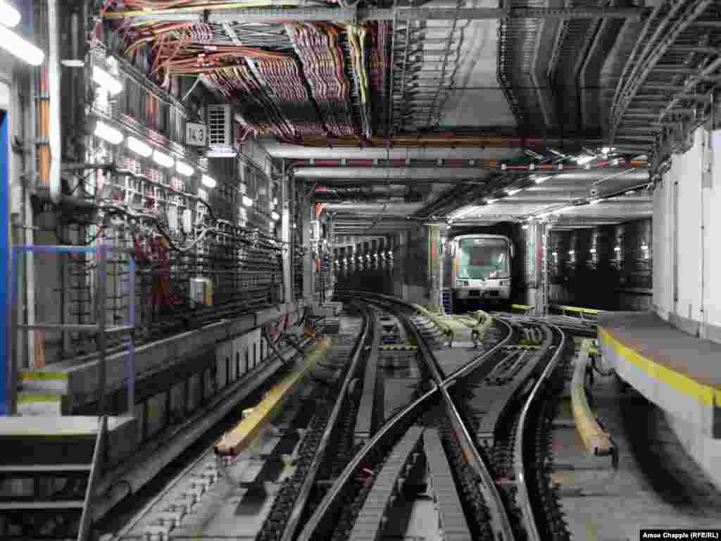 A subway train awaits its morning duties as a blast door is tested nearby. Today, the Prague authorities describe the OSM&rsquo;s purpose as&nbsp;both &ldquo;to protect the population against the effects of weapons of mass destruction for a period of 72 hours,&quot; and &ldquo;to isolate sections of the metro in the event of a major flood.&rdquo;