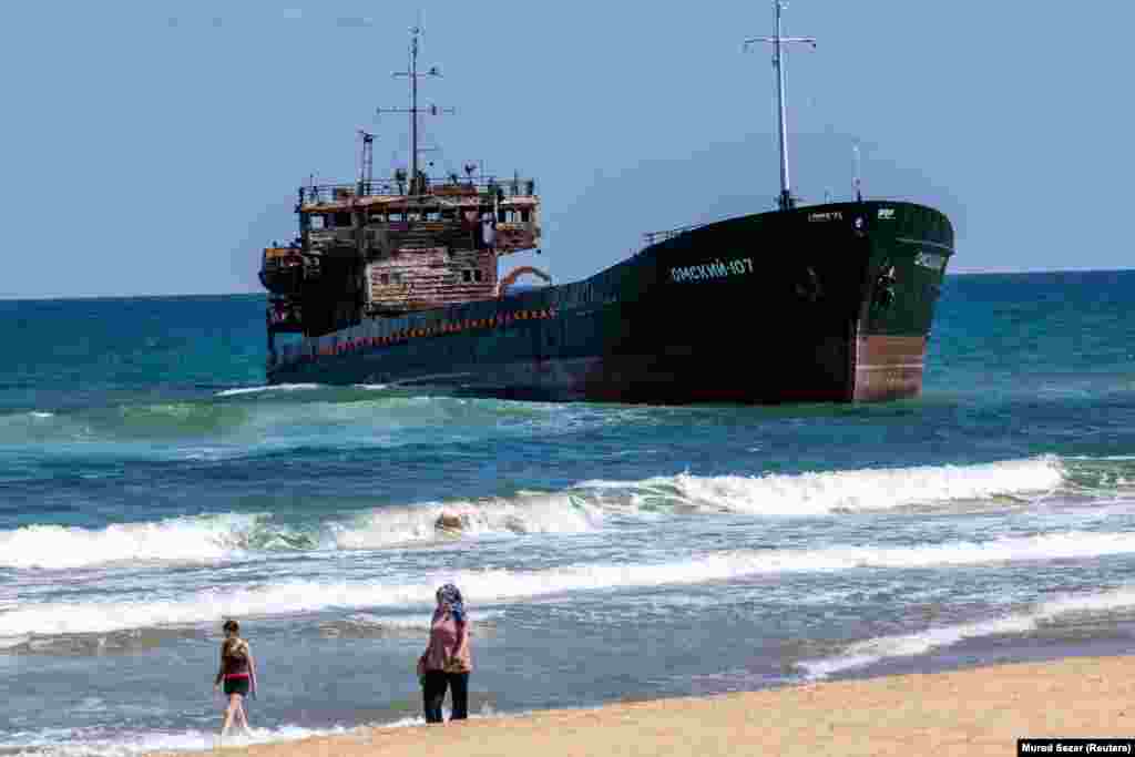 The Russian-flagged Omskiy-107 photographed on September 1 after running aground near Istanbul. The cargo ship's crew had abandoned the vessel after it was attacked by drones near Novorossiysk at an unknown date in August.<br><br>Tomas Alexa, a senior analyst with maritime risk management firm <a href="https://ambrey.com/" class="wsw__a"><strong>Ambrey</strong></a>, told RFE/RL that attacks on shipping in the Black Sea have surged since Ukraine launched <a href="https://en.wikipedia.org/wiki/Operation_MoLoChKa" class="wsw__a"><strong>Operation Molochka</strong></a> in early July. The drone campaign aims to disrupt maritime trade routes that Russia relies on for revenue.