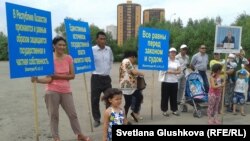 Protesters say local authorities routinely confiscate land from people with dubious justification. They have held similar actions in recent months, such as this one in Astana in June.