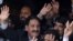 Iftikhar Muhammad Chaudhry (left) waves to supporters at his residence in Islamabad after his reinstatement was announced