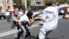 Armenia - Riot police clash with activists blocking a major Yerevan street in protest against the construction of a nearby building, 22Aug2013.