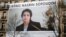 A banner with a giant portrait of jailed Iranian lawyer Nasrin Sotoudeh is seen on the headquarters of the French National Bar Council, which demanded her release, in Paris in March.